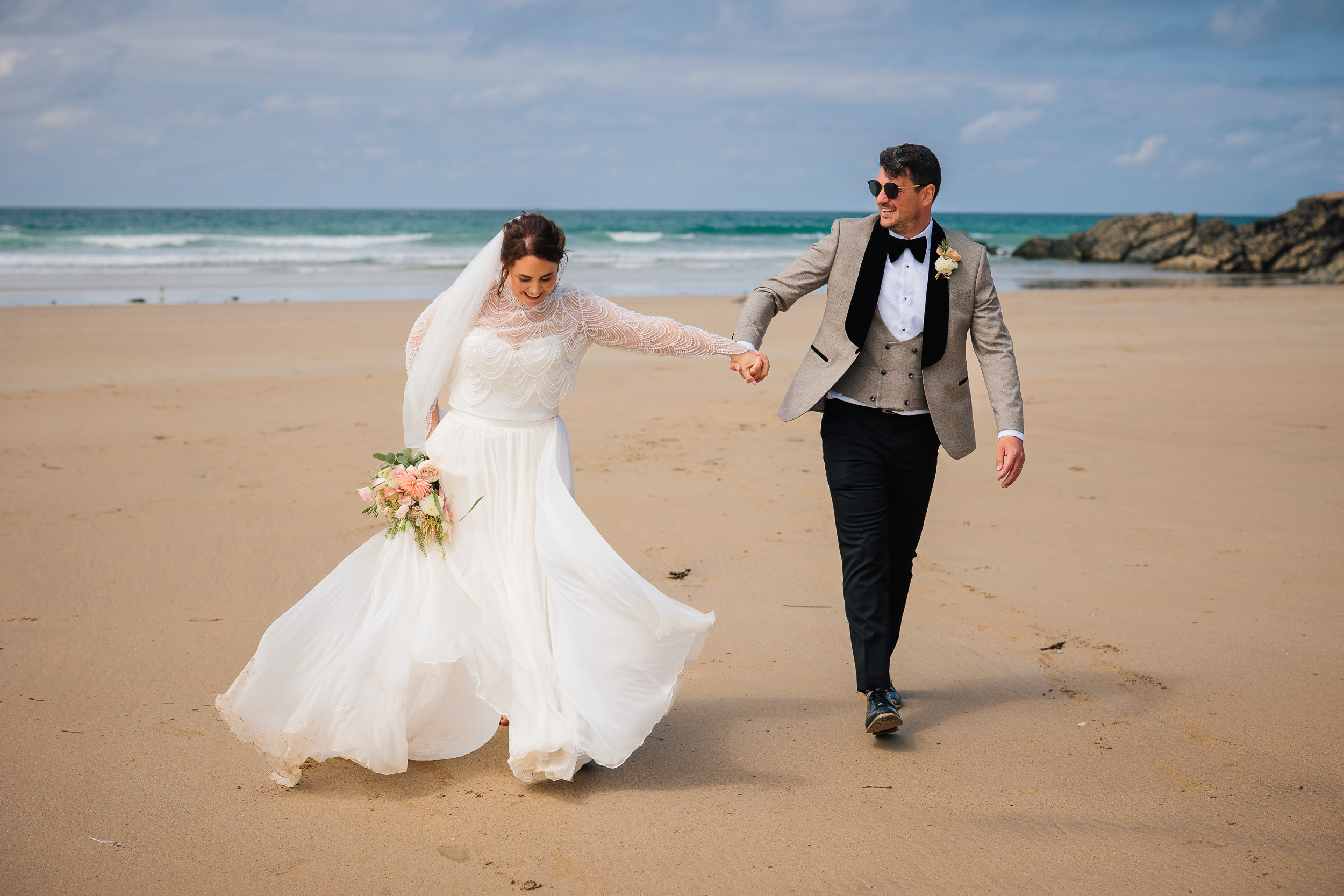 Jason and Laura just after their wedding ceremony on the beach at Lusty Glaze, Newquay, Cornwall captured by Chris Armstrong Photography