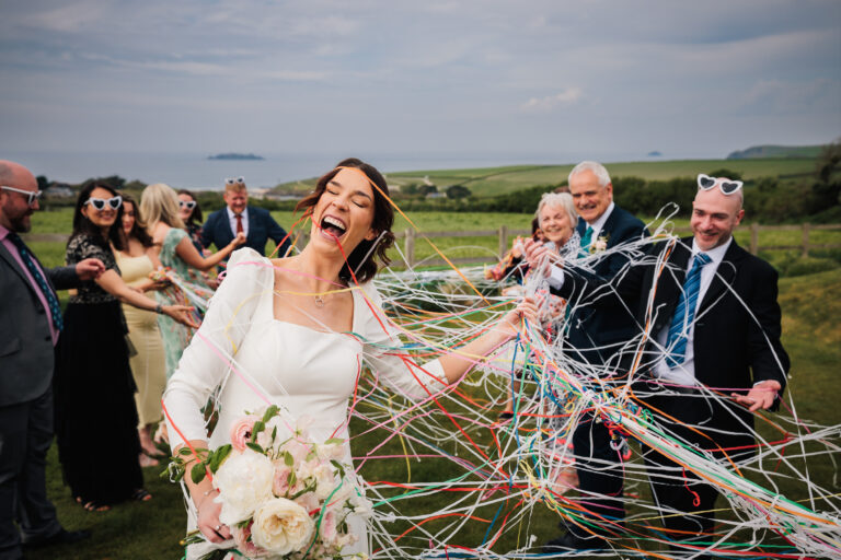 Al and Jen during their ceremony where they used string confetti during their micro wedding in cornwall.Captured by Cornwall Wedding Photographer Chris Armstrong Photography